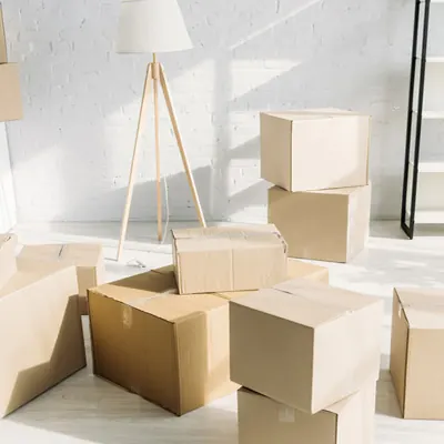 Stacked moving boxes ready for a move-out cleaning